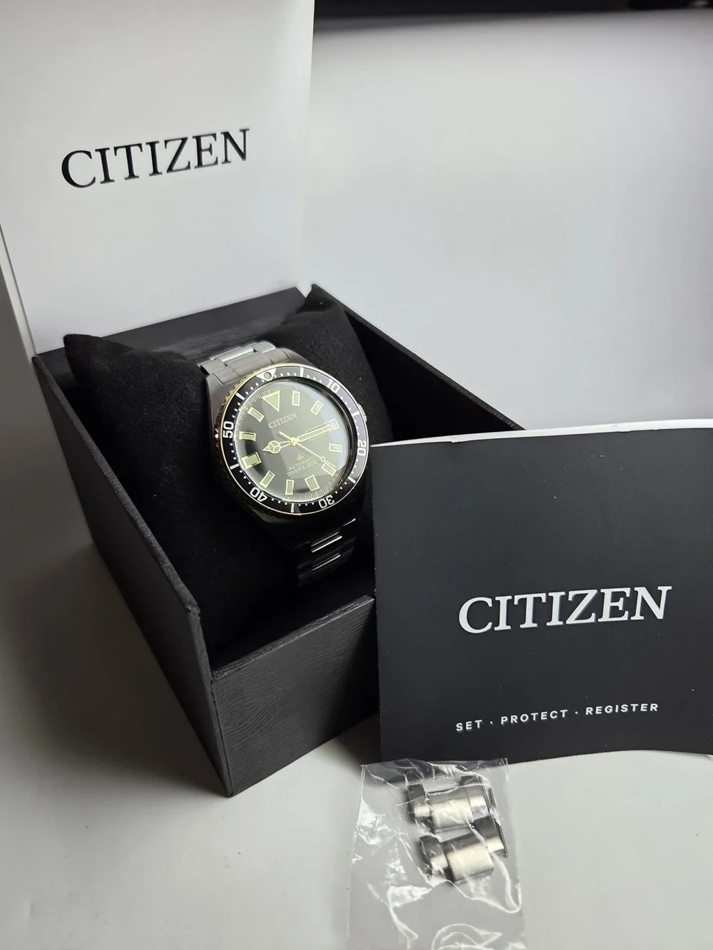 Citizen Black Dial Stainless Steel Diver Watch with Gold Accents